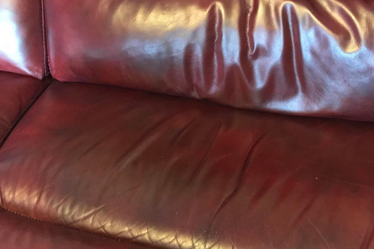 Second red leather sofa after repair