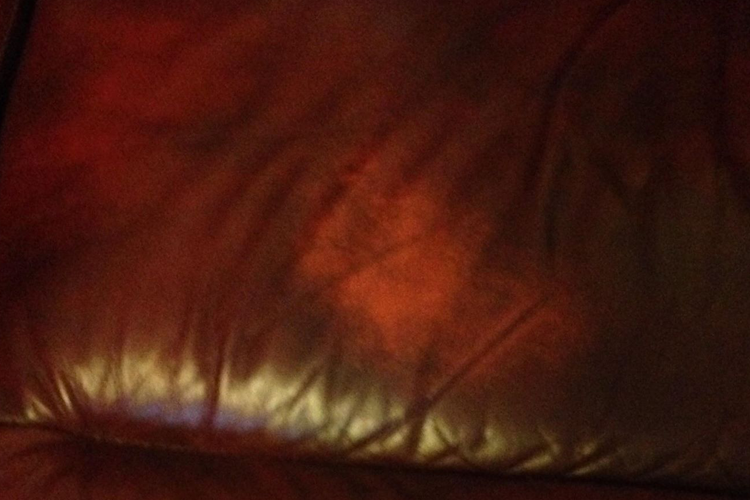 Second red leather sofa before repair