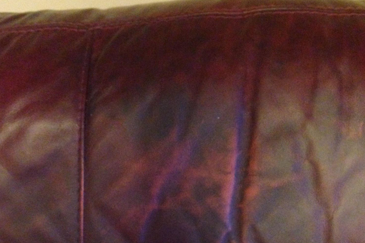 Second red leather sofa before repair
