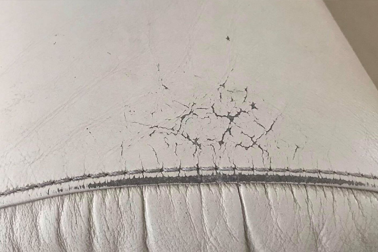 White leather sofa before repair